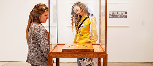 Photo: P. de Grenet Two girls looking at an exhibition